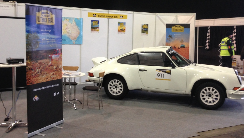 A white Porsche rally car by Tuthill Porsche on the COT stand at Race Retro