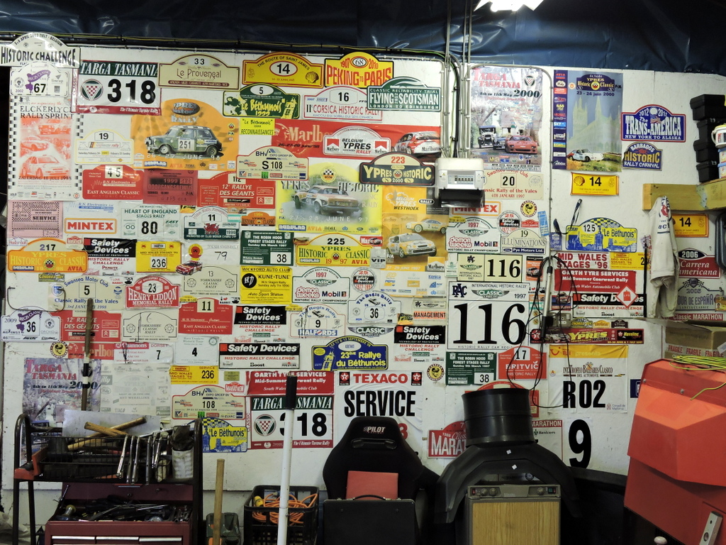A collection of rally decals on David and Sarah Rayner's wall.
