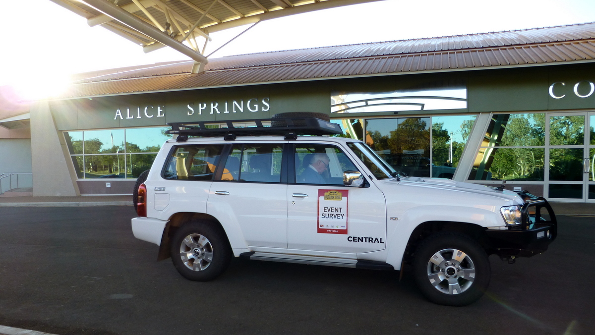 The survey vehicle parked under the portico.