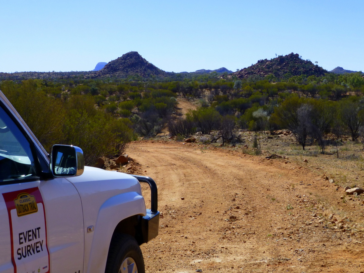 View of distant ranges, with survey car in front.