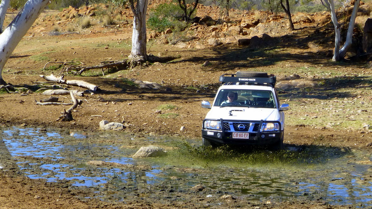 Survey car driving through a spring