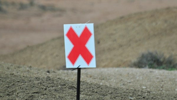 The X board goes exactly at the hazard. 